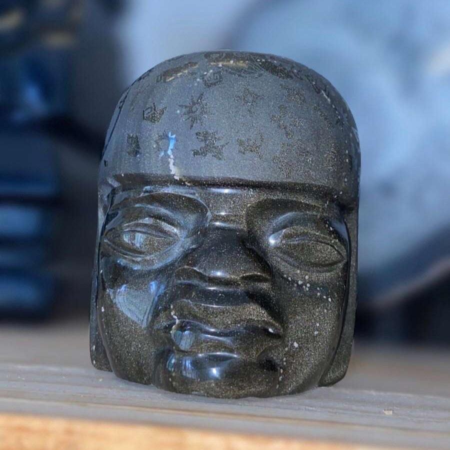 Olmec head carved in golden obsidian with engravings of symbols, pre-Colombian pre-Hispanic Olmec sculpture, Mexican decoration collection