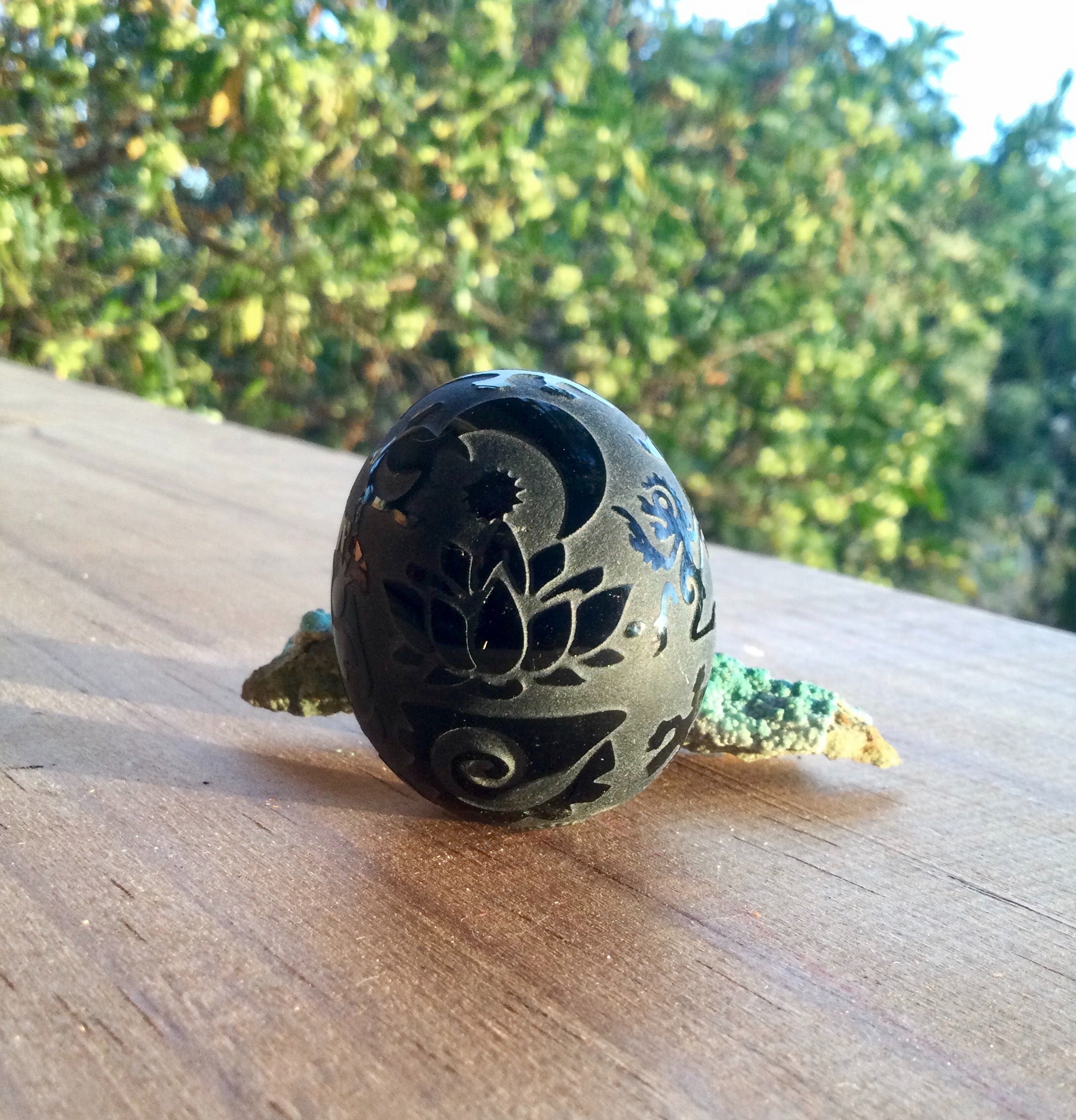 Obsidian egg carving - symbolic decoration, Handcrafted obsidian egg with engraved symbols, Obsidian egg decoration with protective symbolism, Revelatory obsidian egg ornament, Symbolic obsidian egg carving for protection, Hand-carved obsidian egg with me
